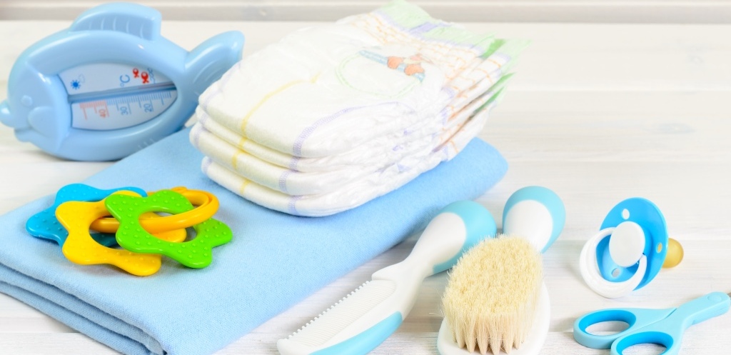 Baby Accessories Baby accessories on white wood background